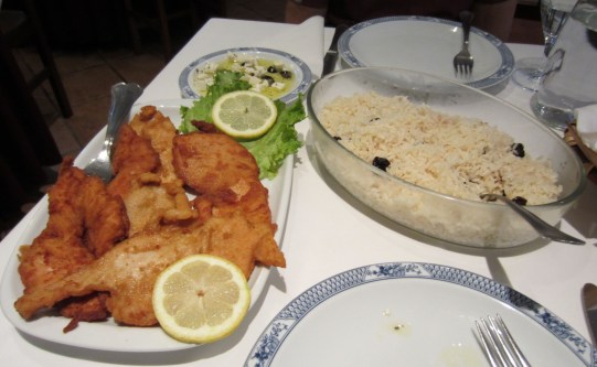 A typical meal from a pilgrims' menu: cheese and olives (top), rice and fried chicken. Served at Casa Cecilia Restaurant near Vilarinho, Portugal. Eight fifty euros including soup entree and cinnamon apple dessert.