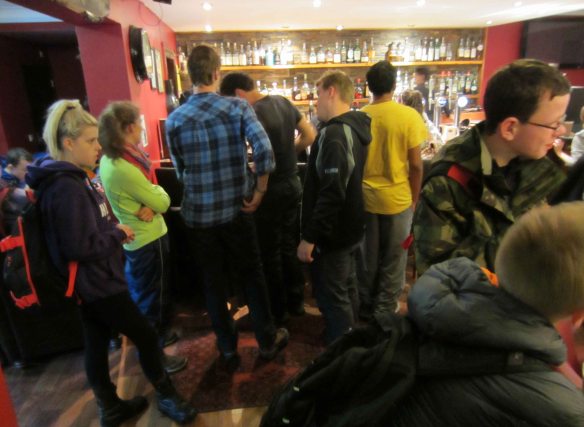 In the Bridge of Orchy Hotel walkers crowd the bar at 11.00 in the morning. 