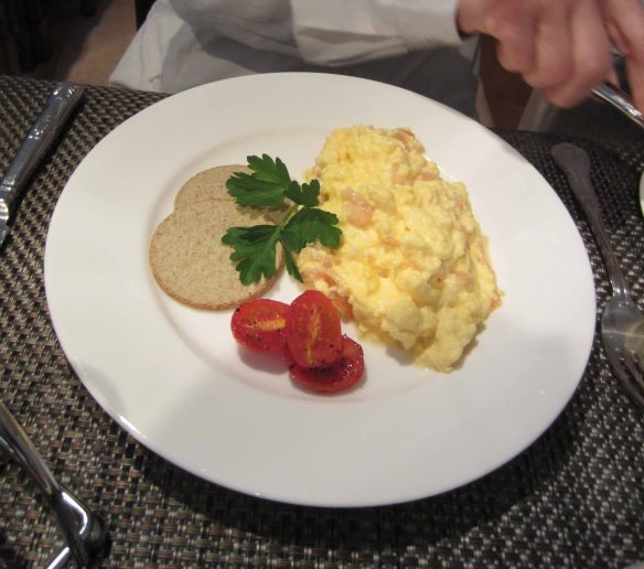 The more digestible option: scrambled eggs with (in this case) oatmeal cakes and cherry tomatoes. 