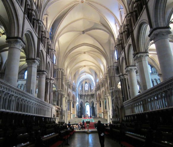 The Quire in Canterbury Cathedral where Evensong is held, with ranks of pews left and right.