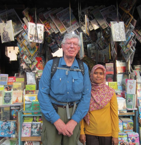 I pose with my favourite bookseller, Ibu Mini. She says her name fits her stature.