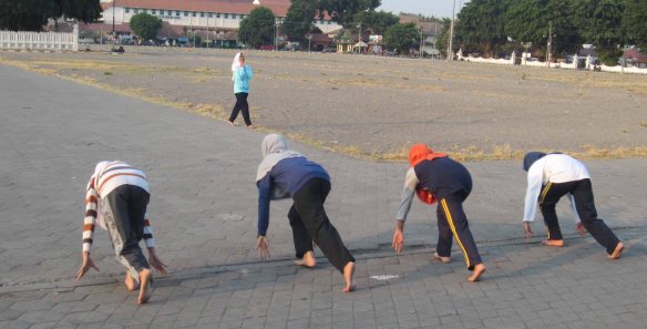 Athletics practice on the alun-alun square in from of the palace. The girls are running towards the square's two sacred banyan tress (top image).